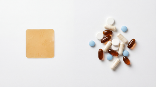 Single amber dissolving oral strip on a white background next to a scattered pile of capsules and tablets